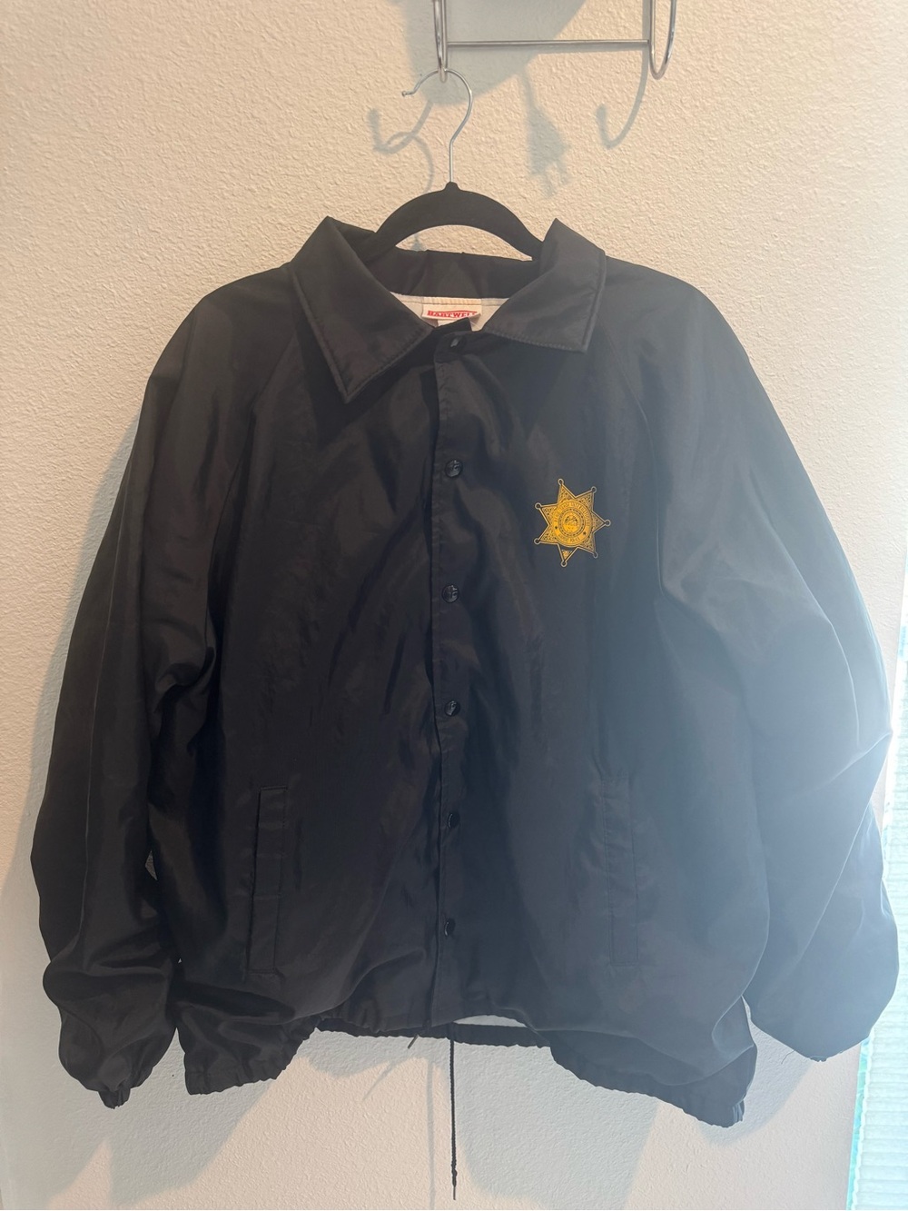 Black Coach-Style Jacket with Gold Star Patch